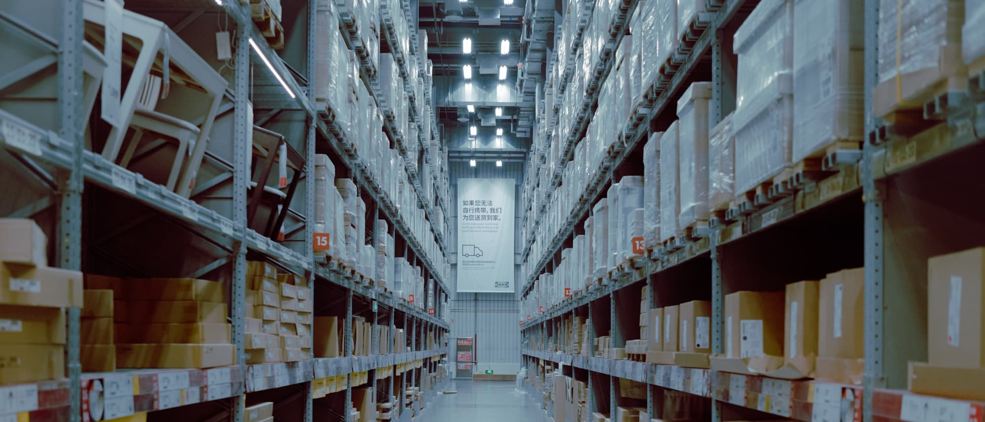 Warehouse aisles stacked with cartons